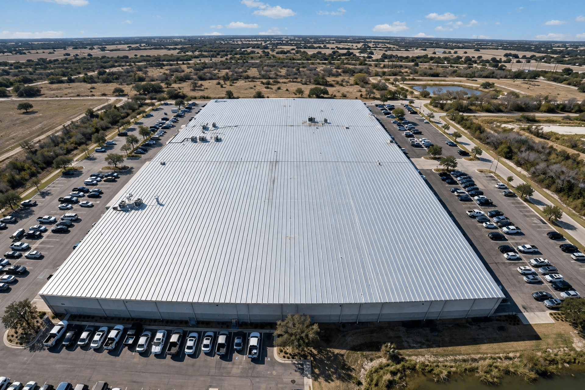 Industrial Roofing Services 2 Finished standing seam metal roof on a Texas industrial building, seen from above